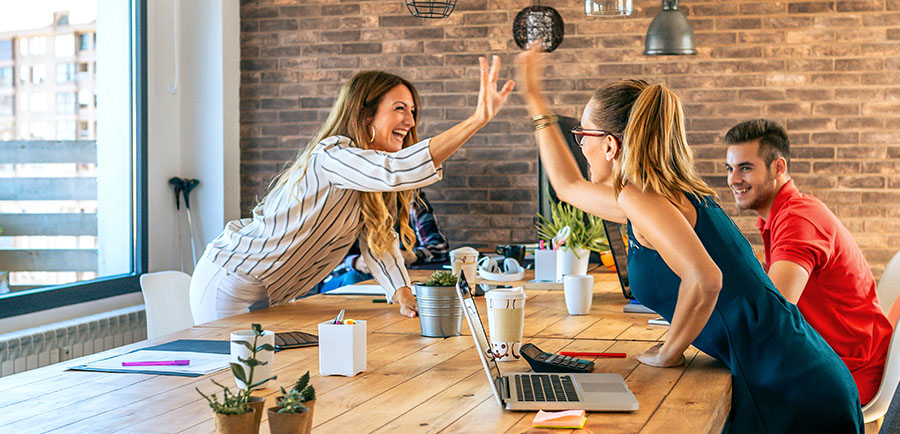 business-women-celebrating-success-highfiving-office business-women-celebrating-success-highfiving-office